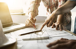 Architects planning on a sheet of paper