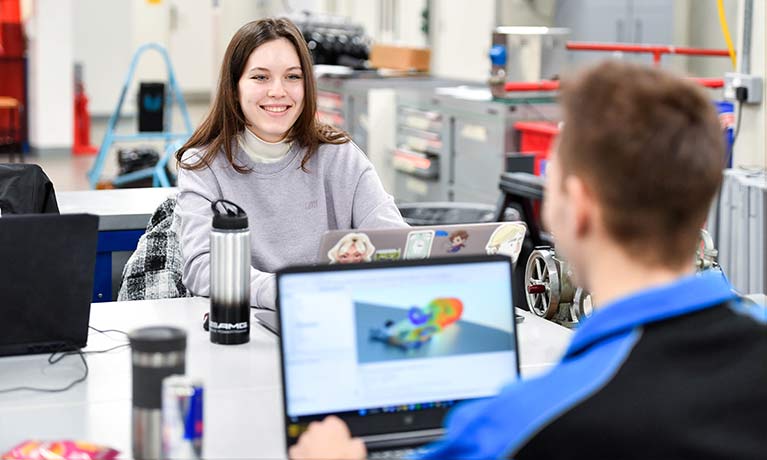female student and male student working in an engineering lab 